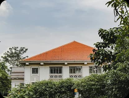Two-story home with a completed terracotta tile roof