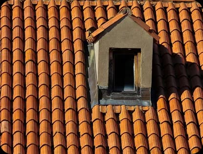 Finished terracotta S-tile roof with dormer detail
